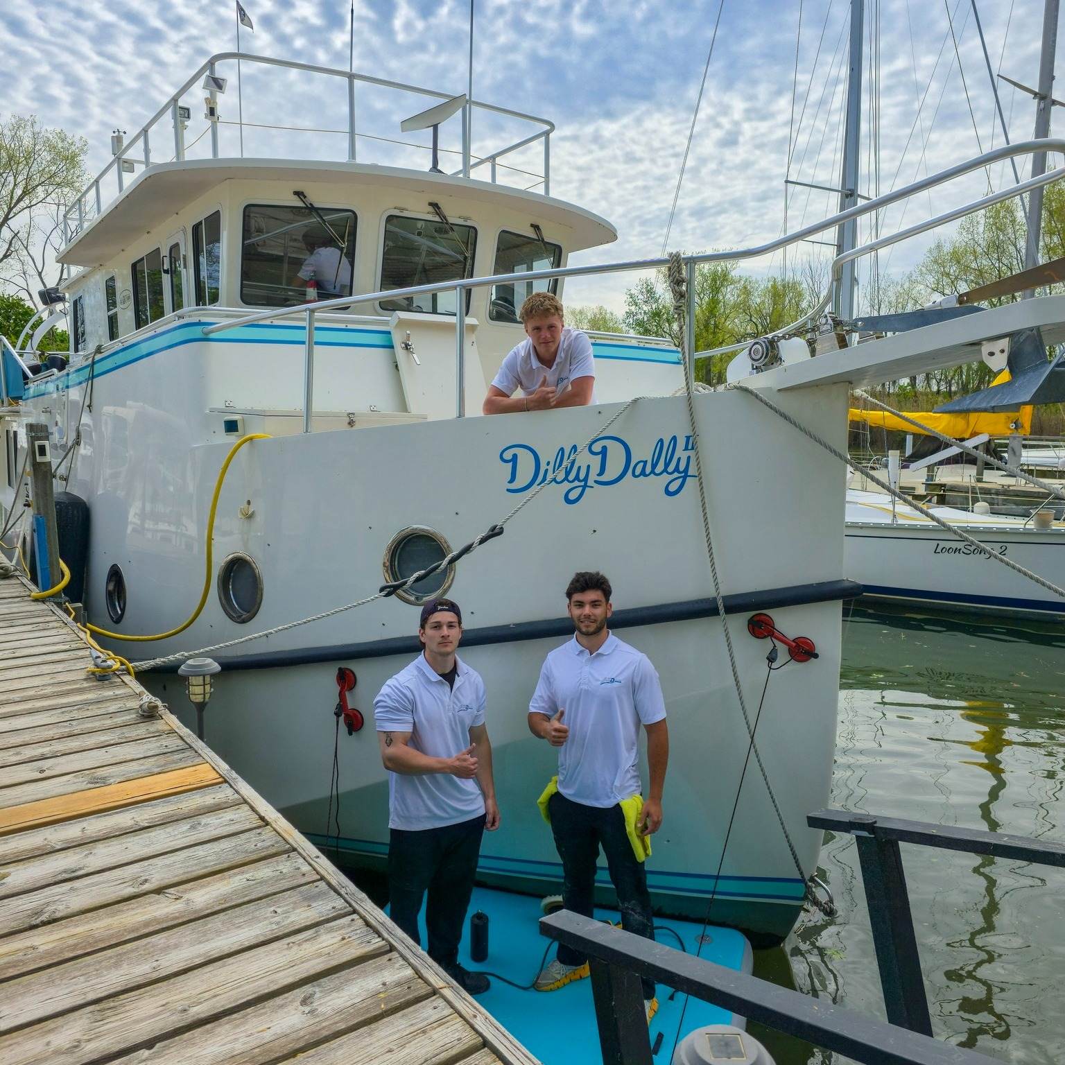 The All Pro Detailing crew alongside Dilly Dally II in Sarnia